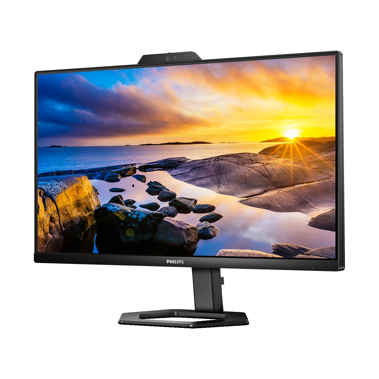 Un monitor Philips mostra un tramonto su coste rocciose.