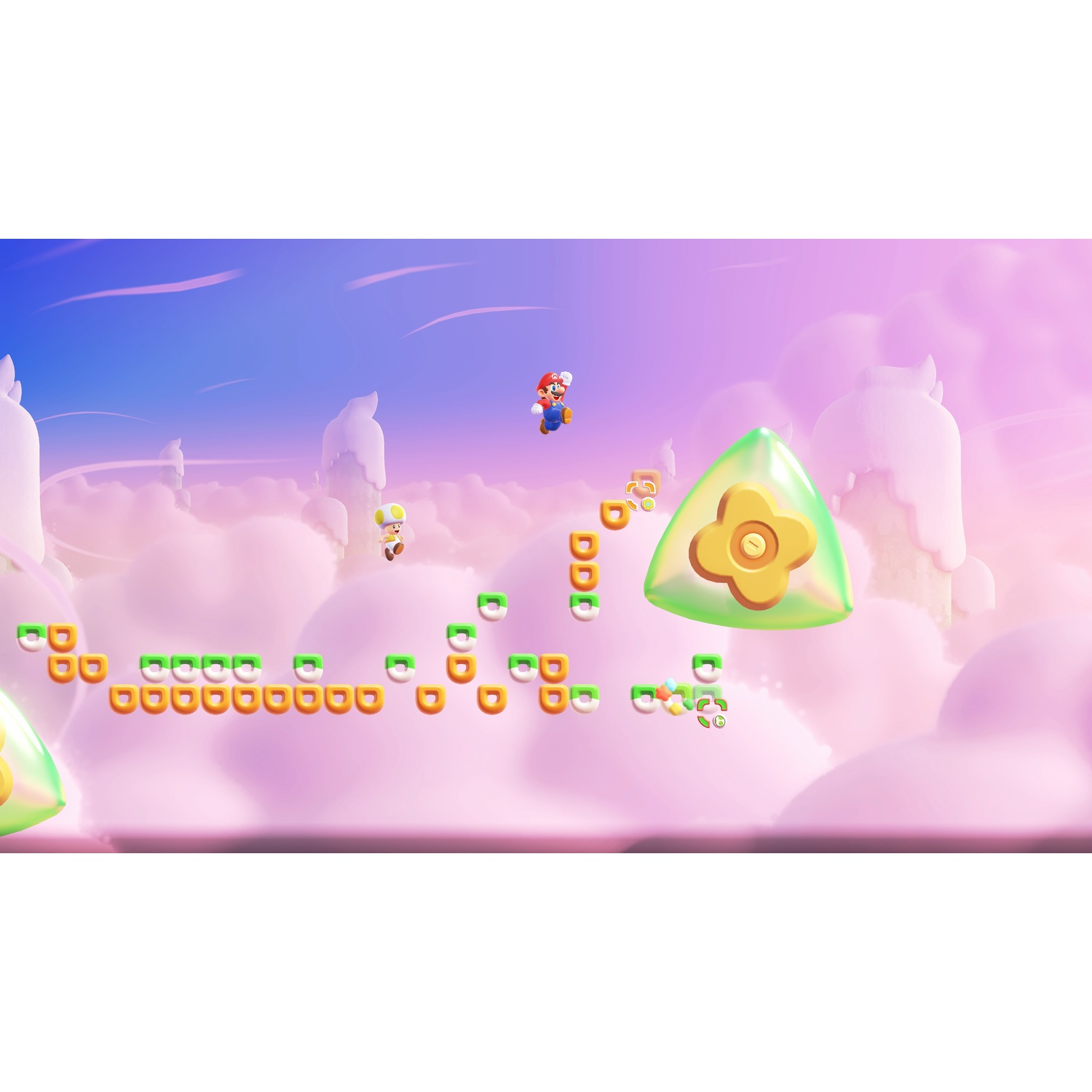 Mario springt door een wolkenwereld met platforms en een groene edelsteen.