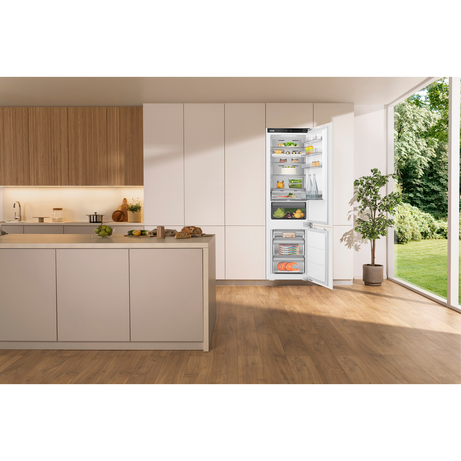 A kitchen with an open refrigerator filled with food items.
