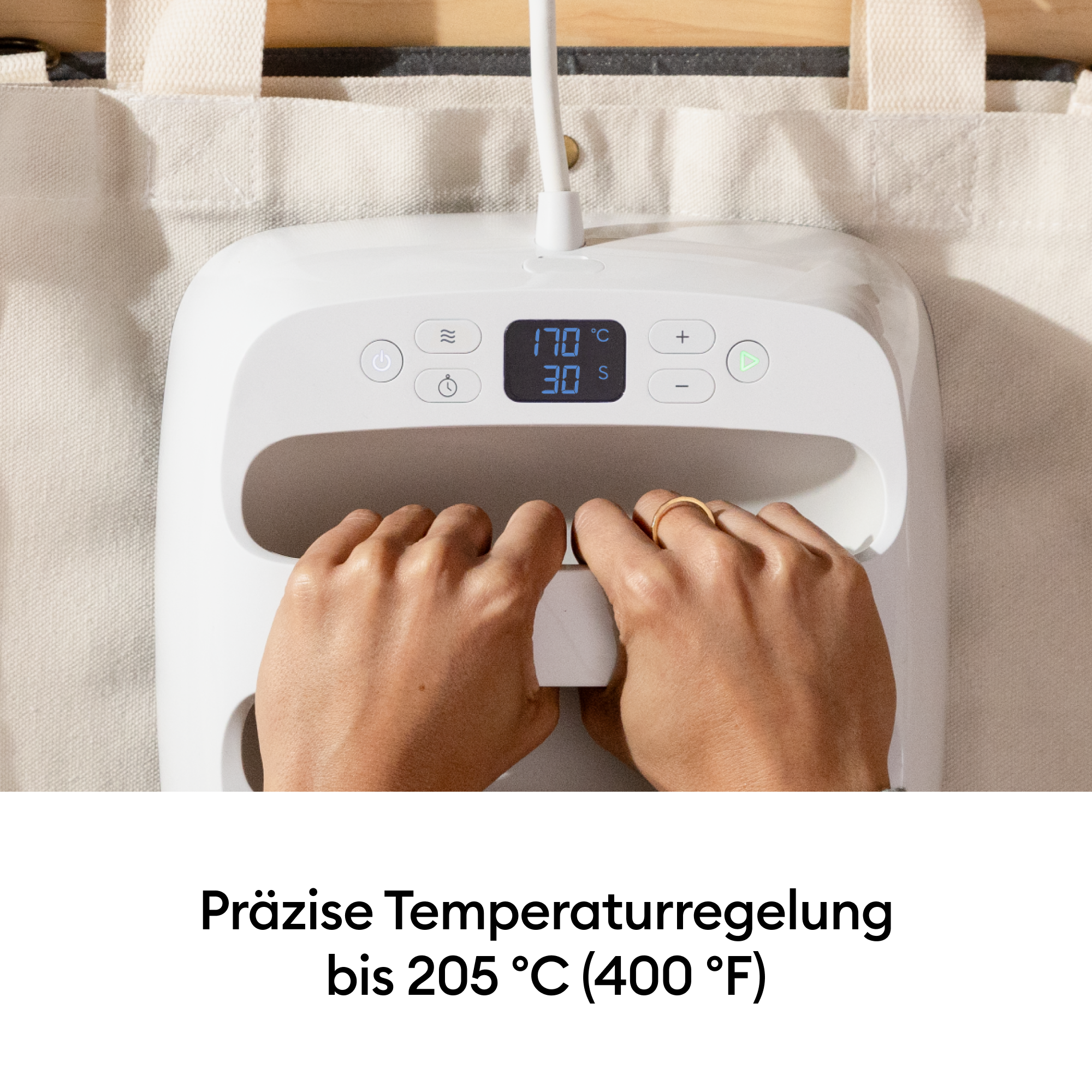 Eine weiße Heißpresse mit Händen, die sie bedienen. Temperatur 170°C, Zeit 30s.