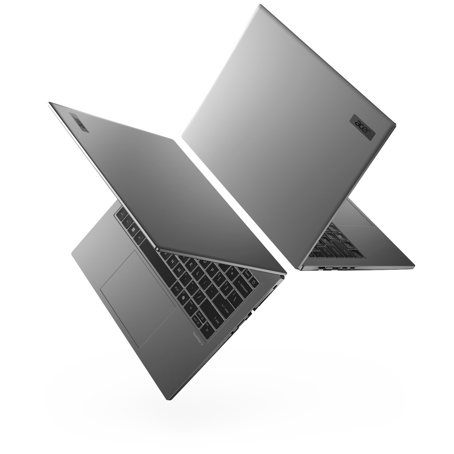 Two silver Acer TravelMate X laptops angled against a white background.