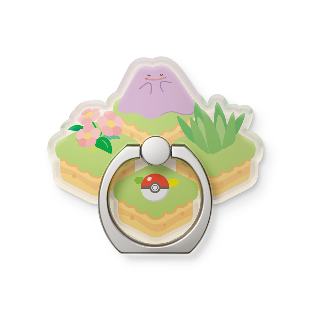 Pierścień do telefonu z Ditto, kwiatami i pokeballem na zielonym terenie.