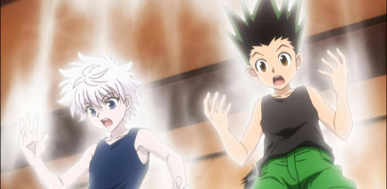 Zwei anime-Jungen, Gon und Killua, mit leuchtenden Aura und schockierten Gesichtern.