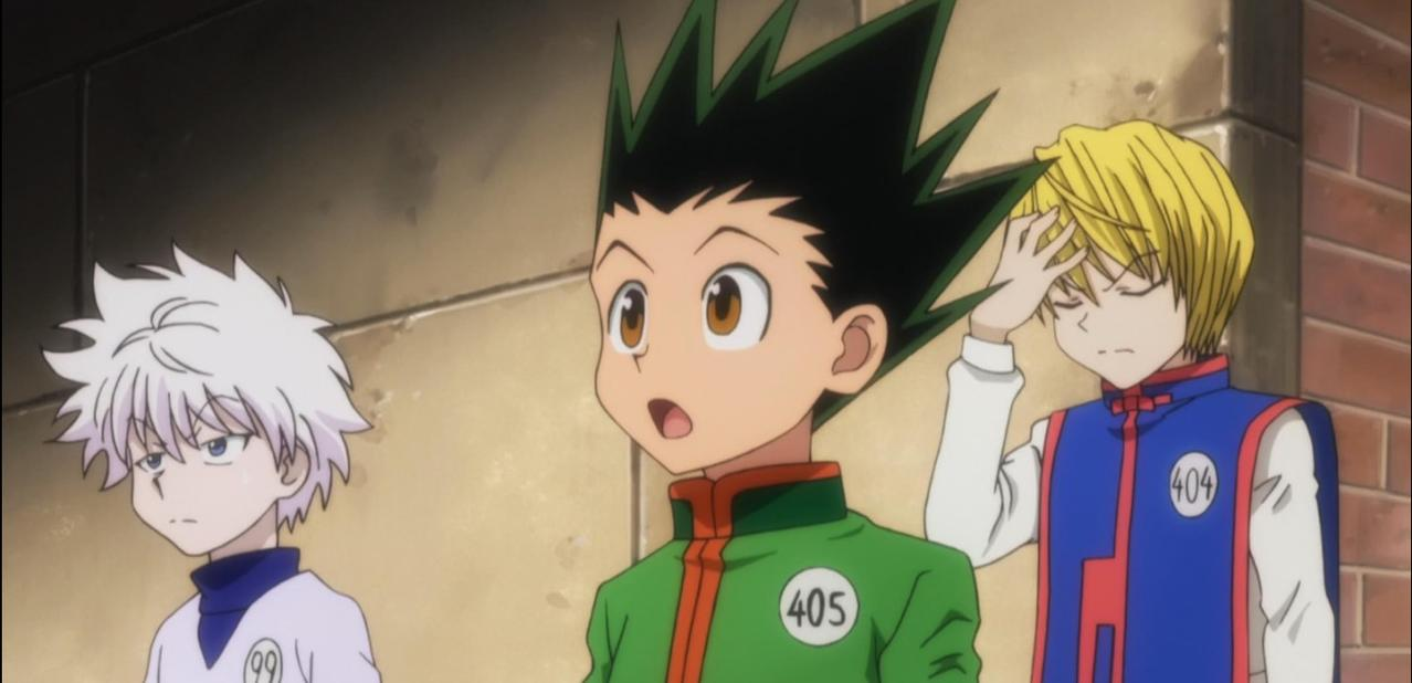 Drei Anime-Charaktere: Gon, Killua und Kurapika, stehen nebeneinander.