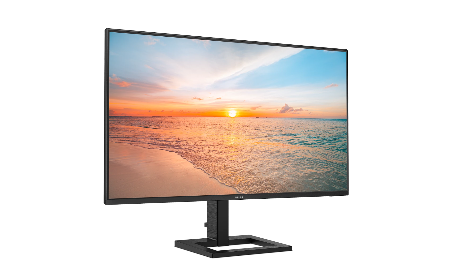 Un monitor Philips negro muestra un atardecer en la playa con palmeras.