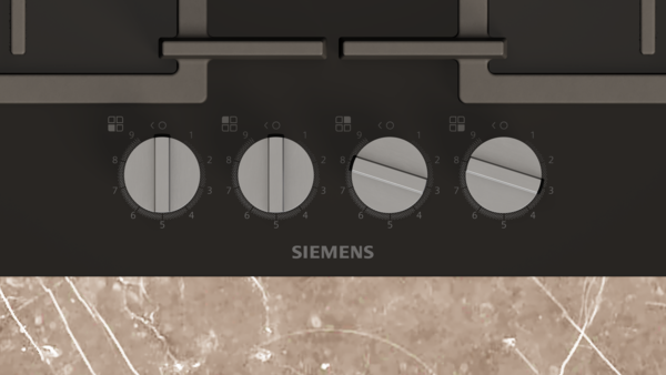 Siemens logolu siyah ocakta dört kontrol düğmesi.