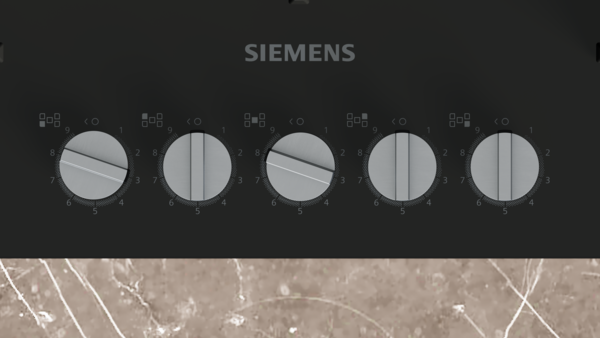 Siemens ocak, bazılarında işaretler bulunan beş kontrol düğmeli.