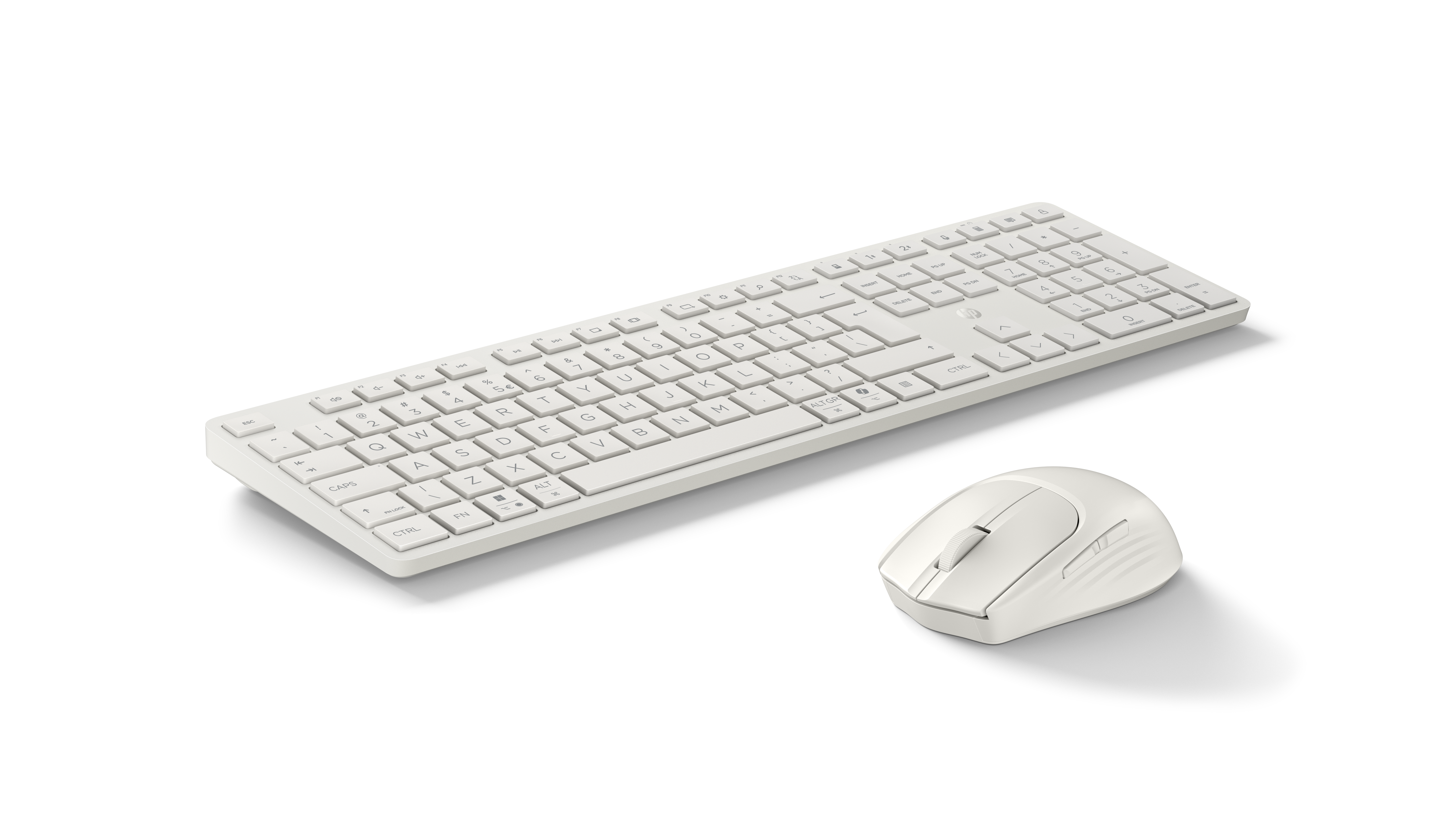 Een witte draadloze toetsenbord- en muisset op een zwarte achtergrond.