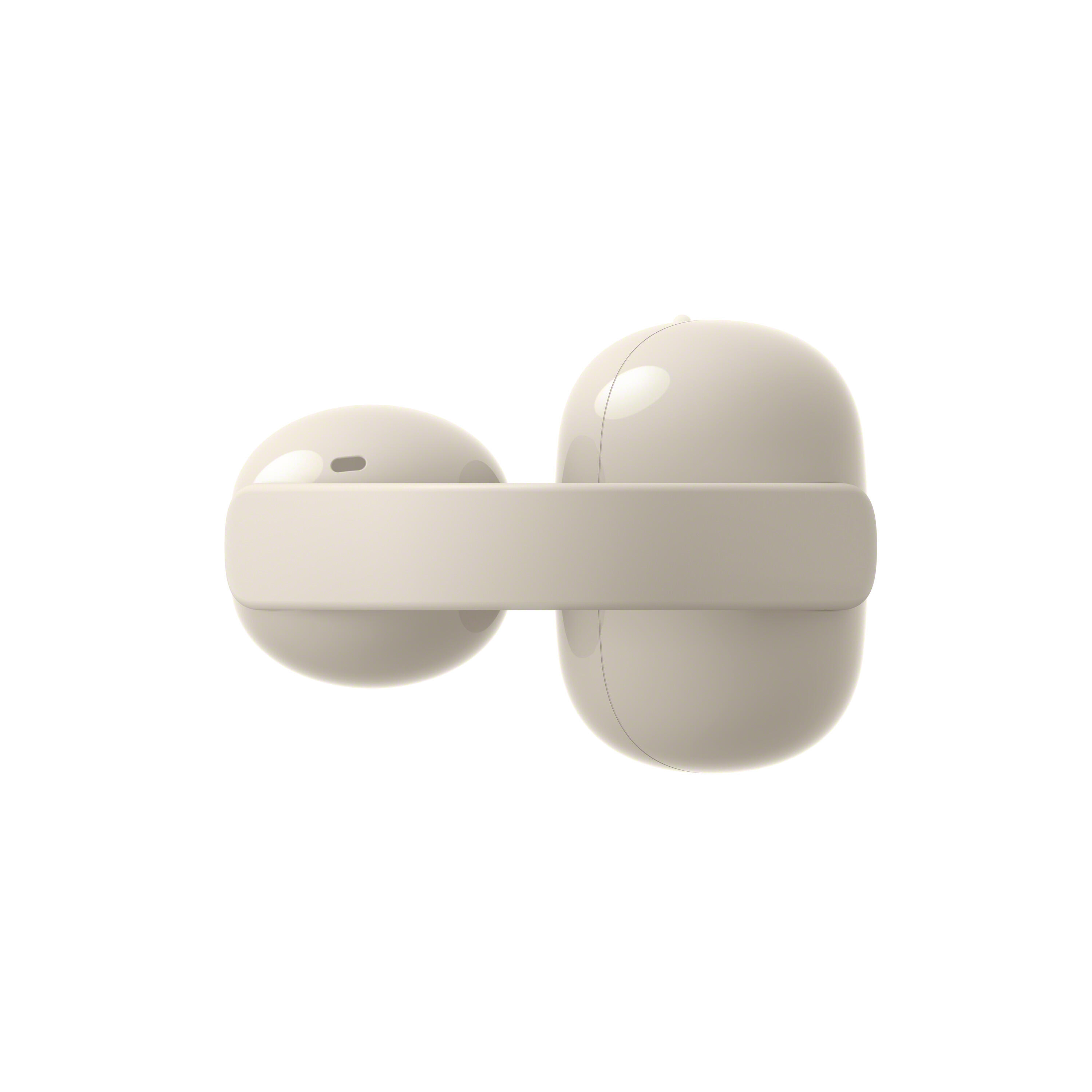 Dos auriculares beige unidos por una banda, sobre fondo blanco.