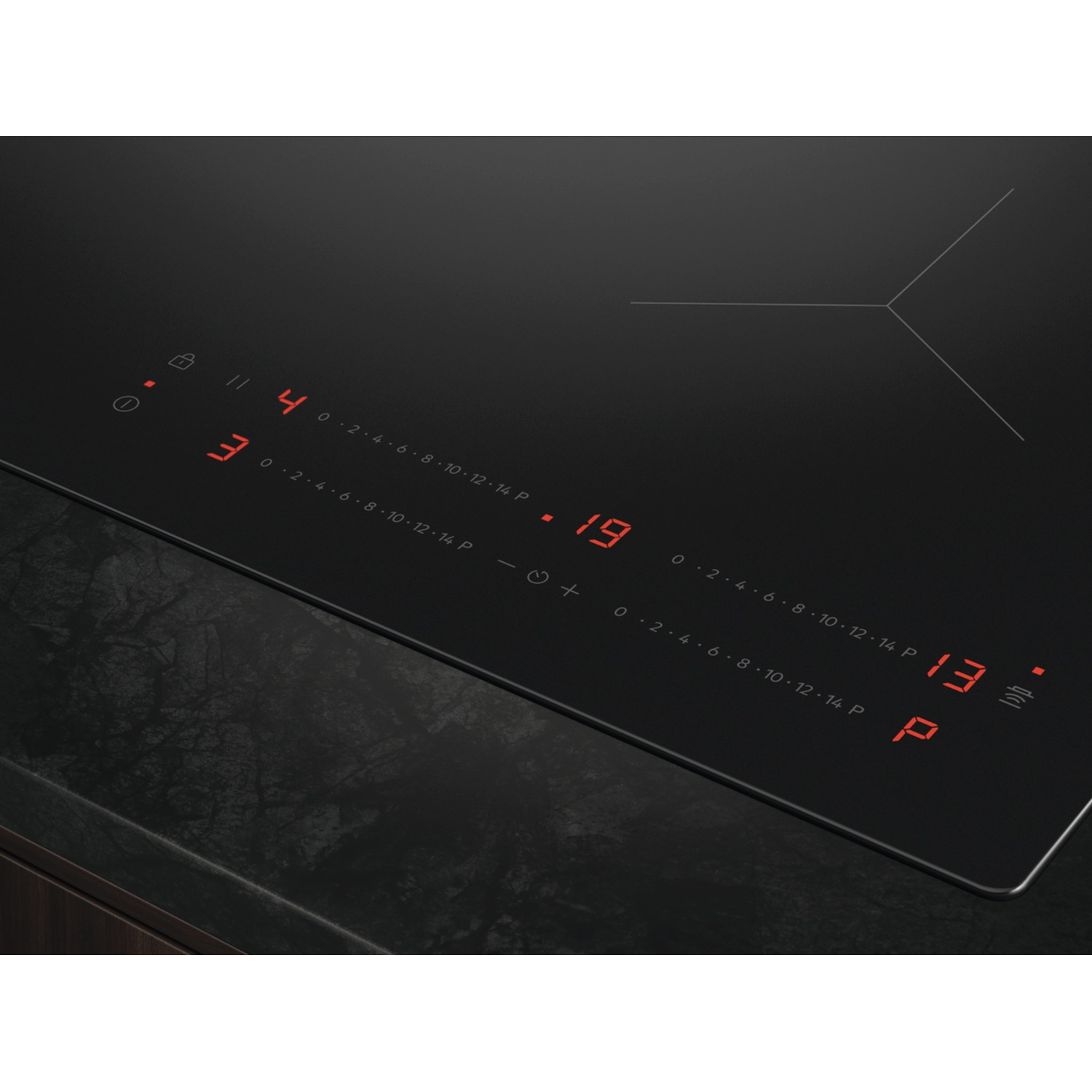 A black induction cooktop with red digital displays for power and timer settings.
