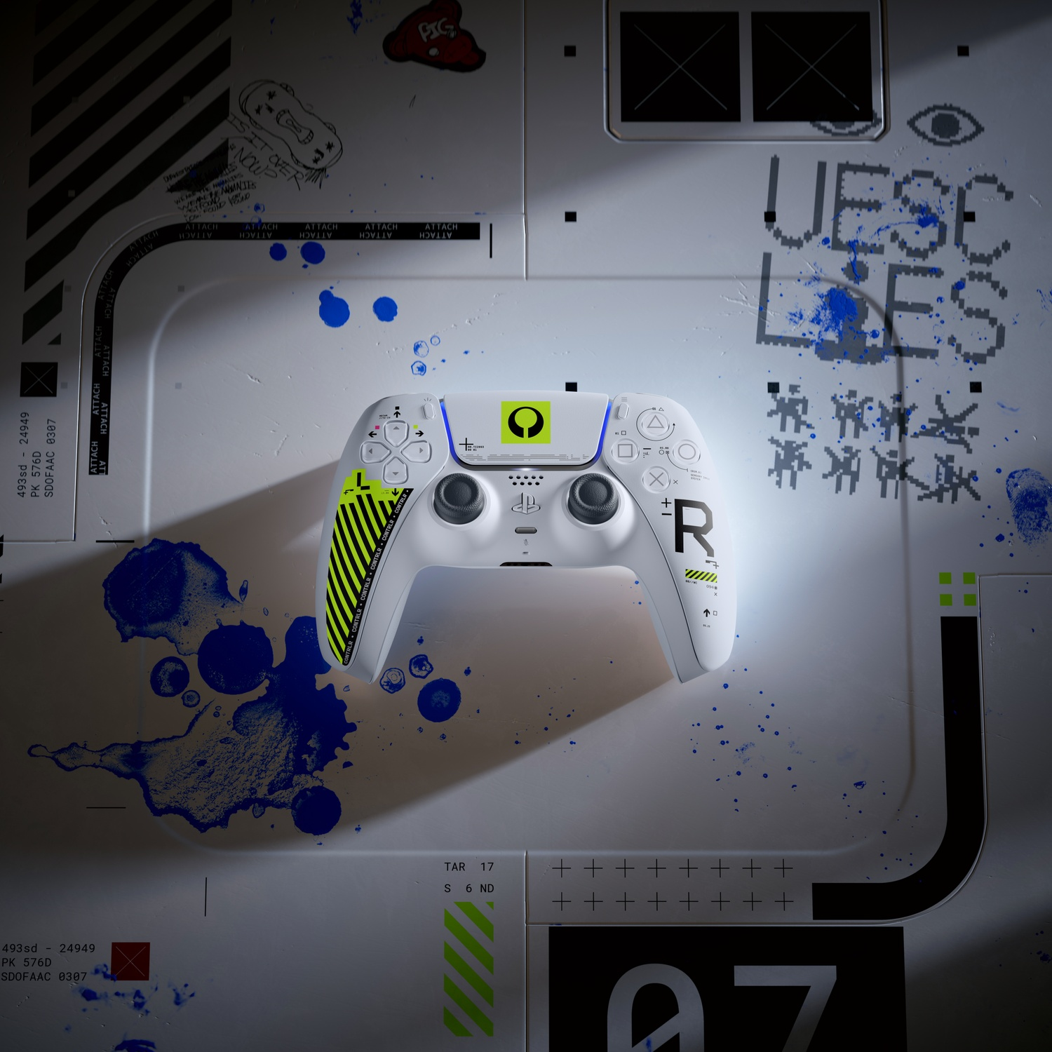 A white controller with yellow accents rests on a metallic surface with blue paint splatters.