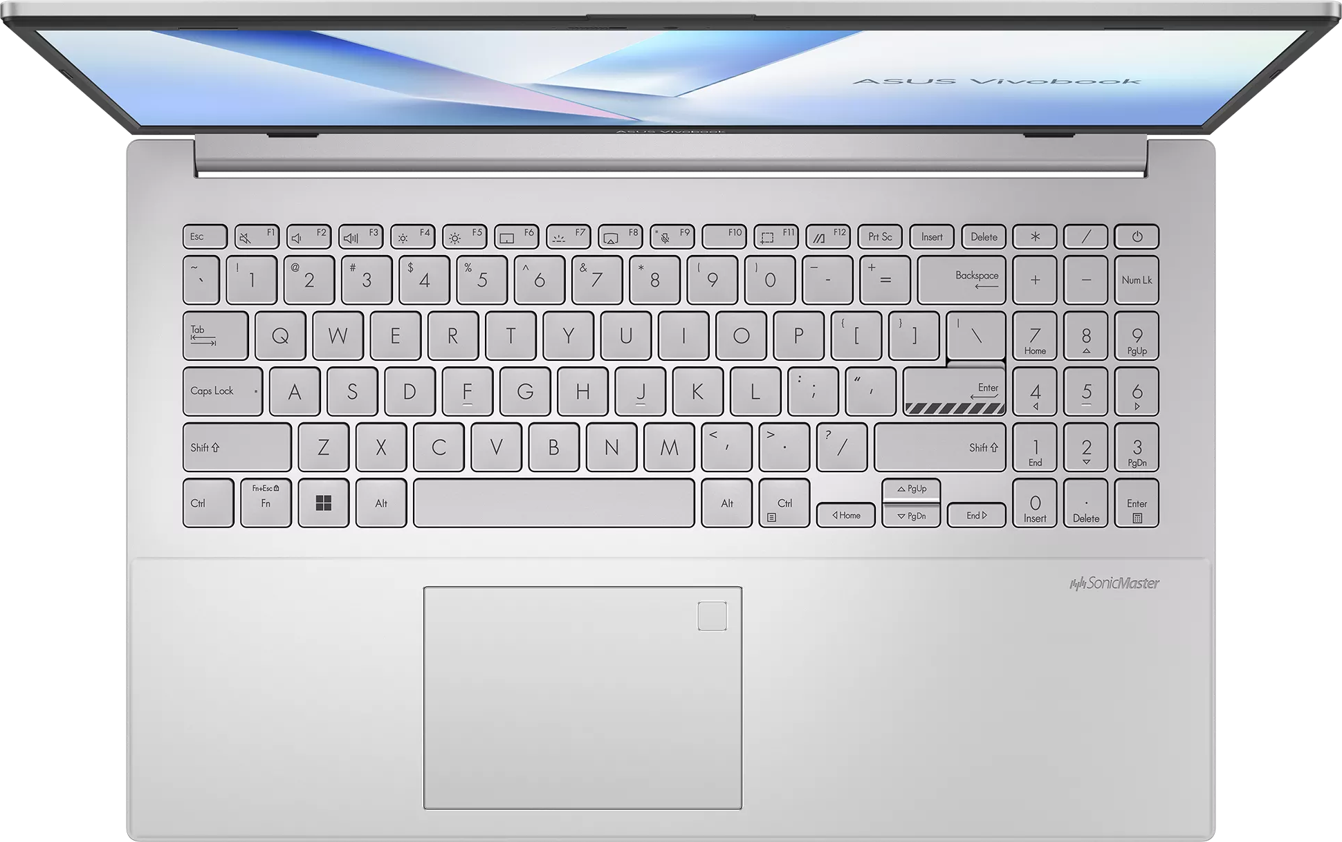 Ezüst Asus Vivobook laptop felülnézetből, billentyűzet és érintőpad látható.