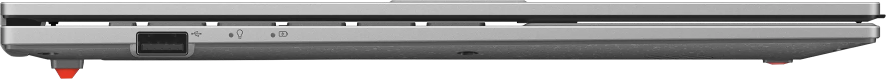 Ezüst laptop USB porttal, töltésjelzővel és akkumulátor ikonnal.