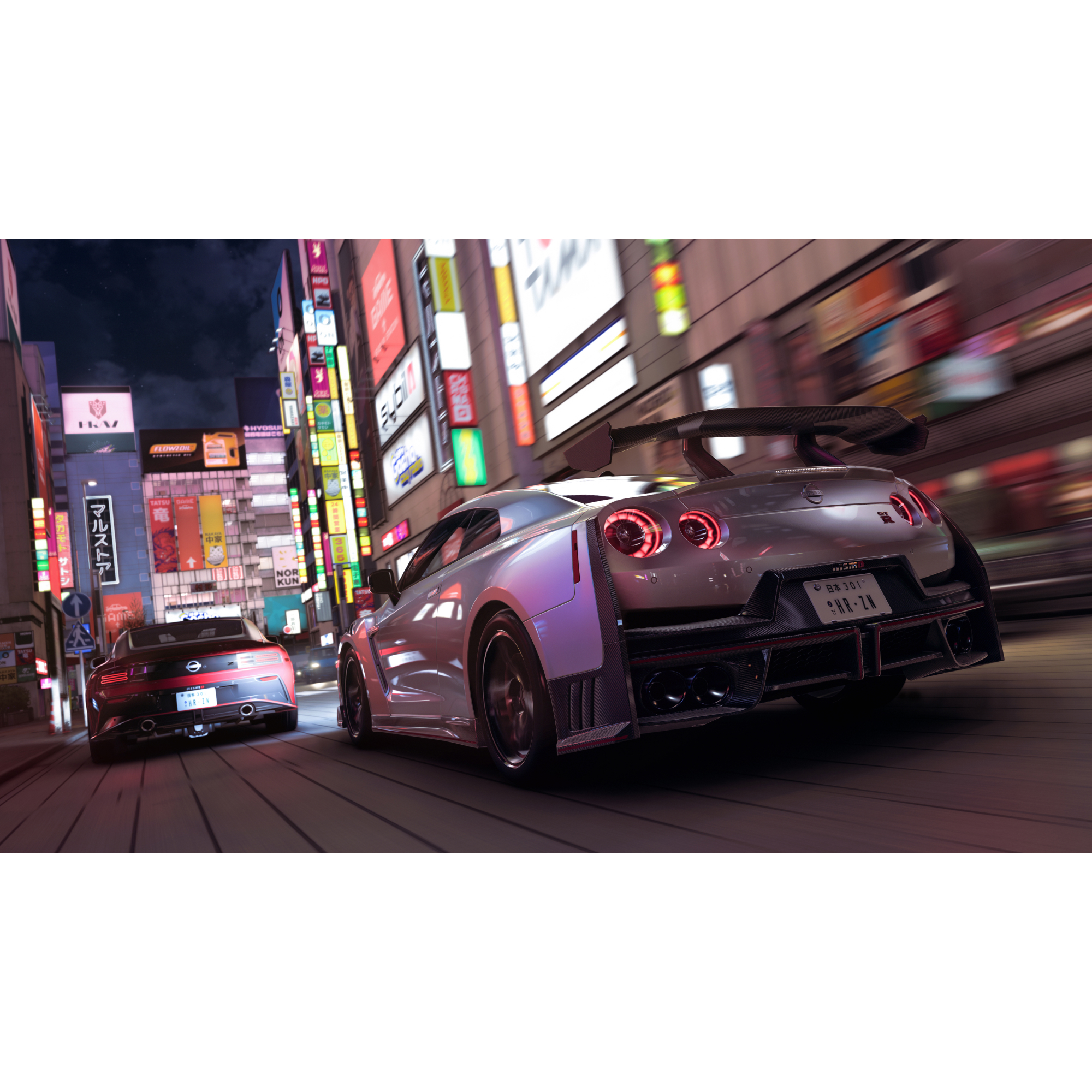 Deux voitures préparées, une Nissan GT-R argentée et une Nissan Z rouge, foncent dans une ville éclairée aux néons la nuit.