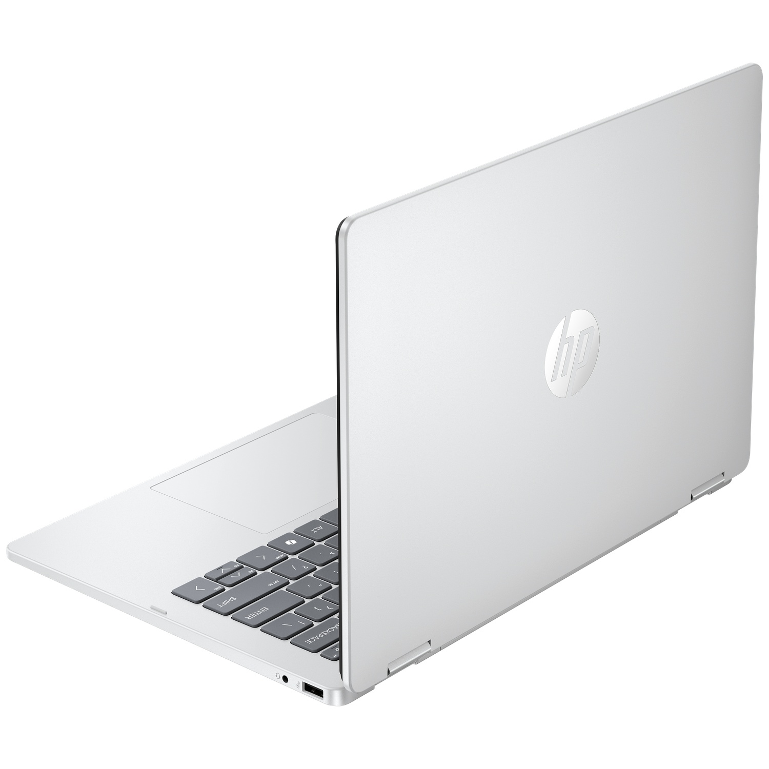 A silver HP laptop is open, showing the keyboard and touchpad. White background.