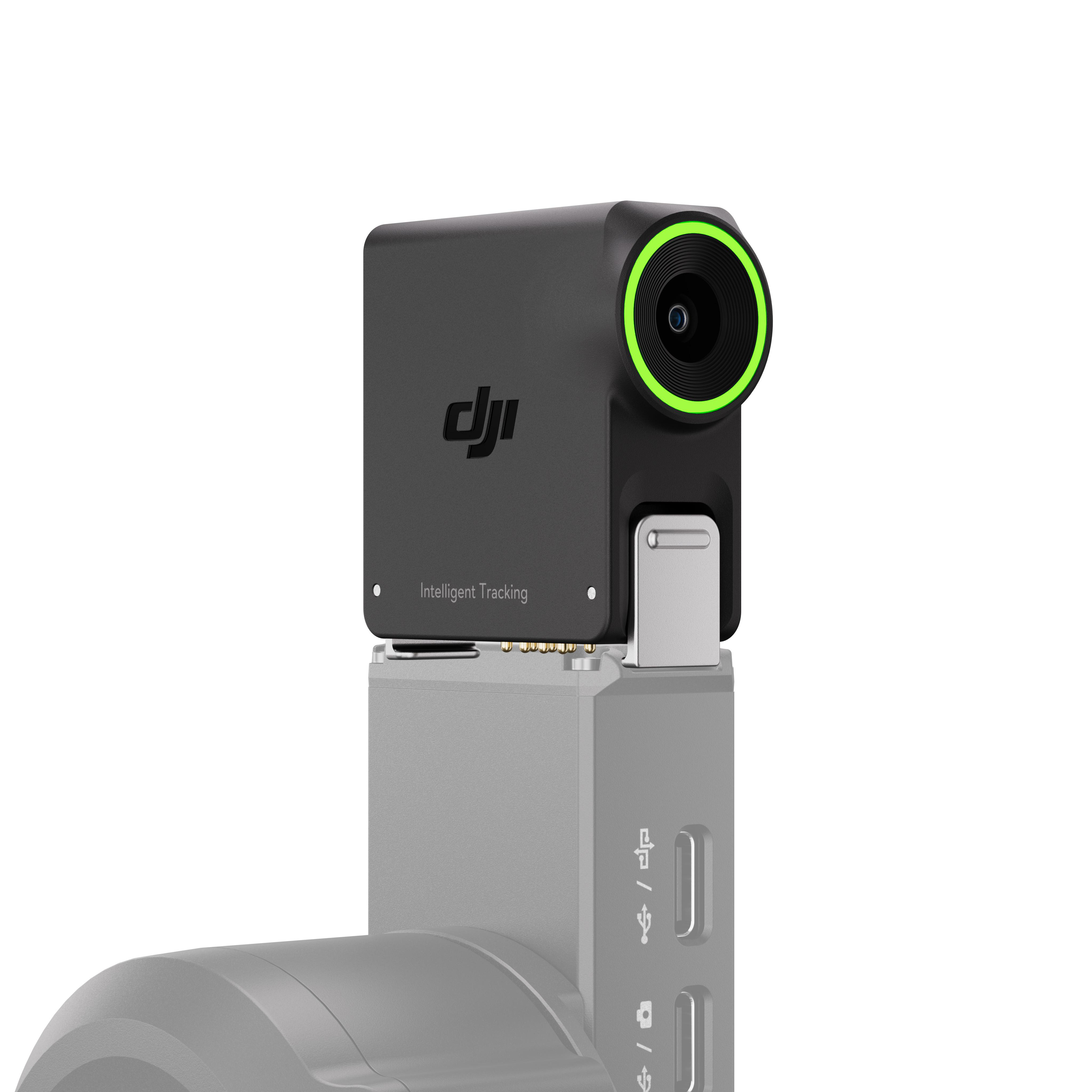 Ein schwarzer DJI-Kameramodul mit grüner Linse ist auf einem grauen Gerät montiert.
