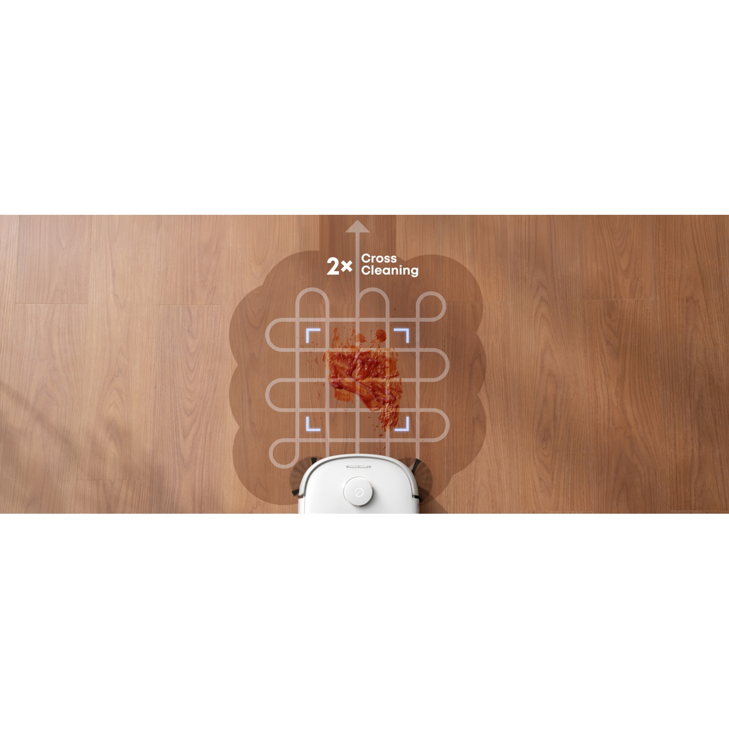 Aspirateur robot blanc nettoie déversement rouge sur parquet avec chemin 2x Cross Cleaning.