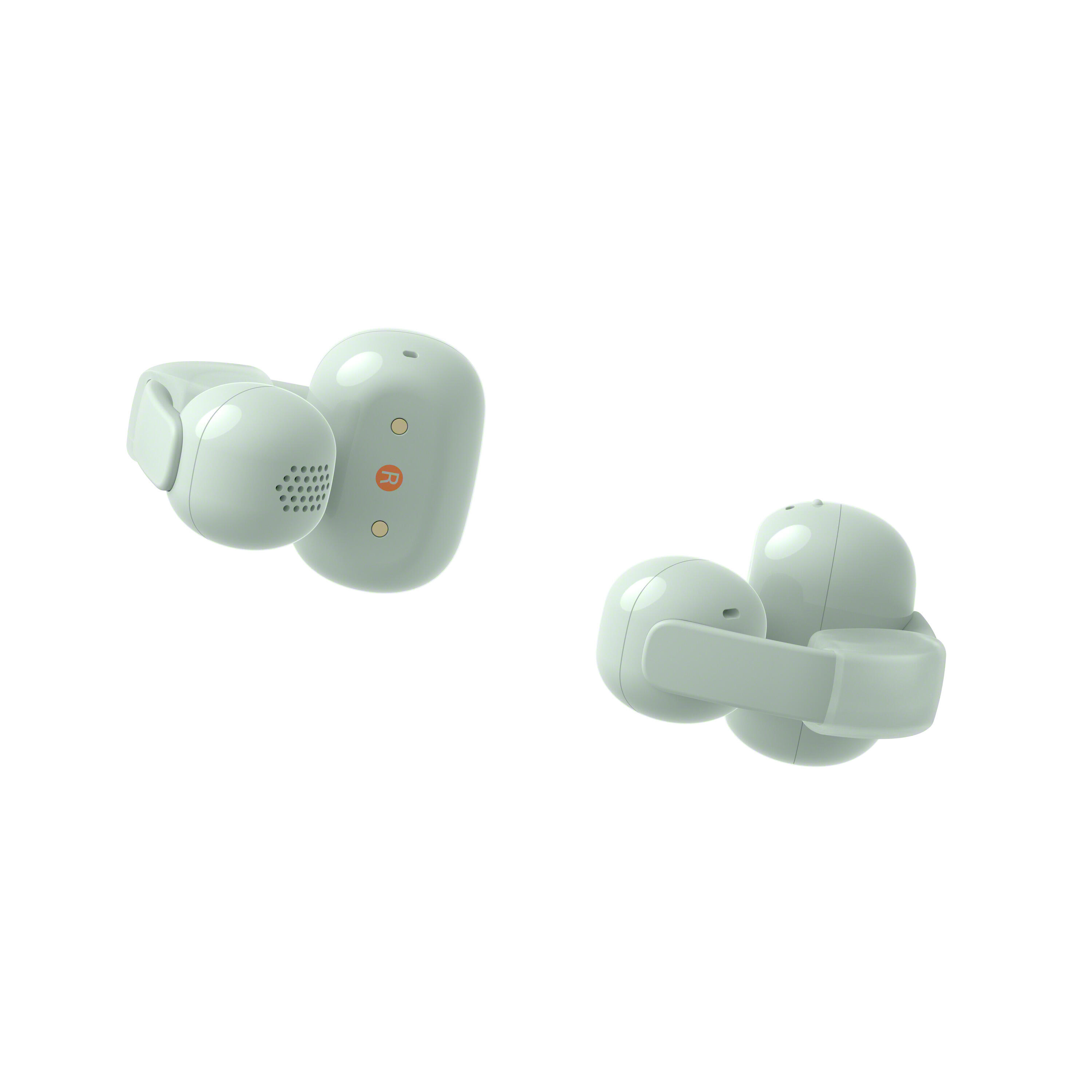 Dos auriculares inalámbricos verde claro aislados sobre fondo blanco.