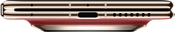 Arany okostelefon piros díszítéssel, USB-C porttal és hangszóróráccsal.
