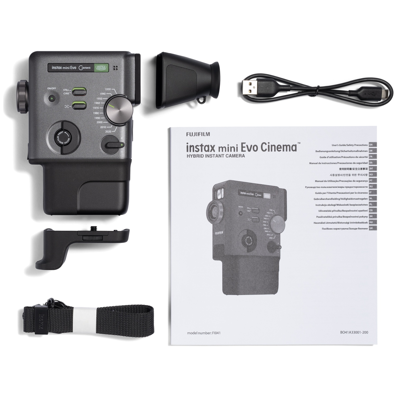 Gray Instax Mini Evo camera with accessories: strap, grip, USB cable, and manual.