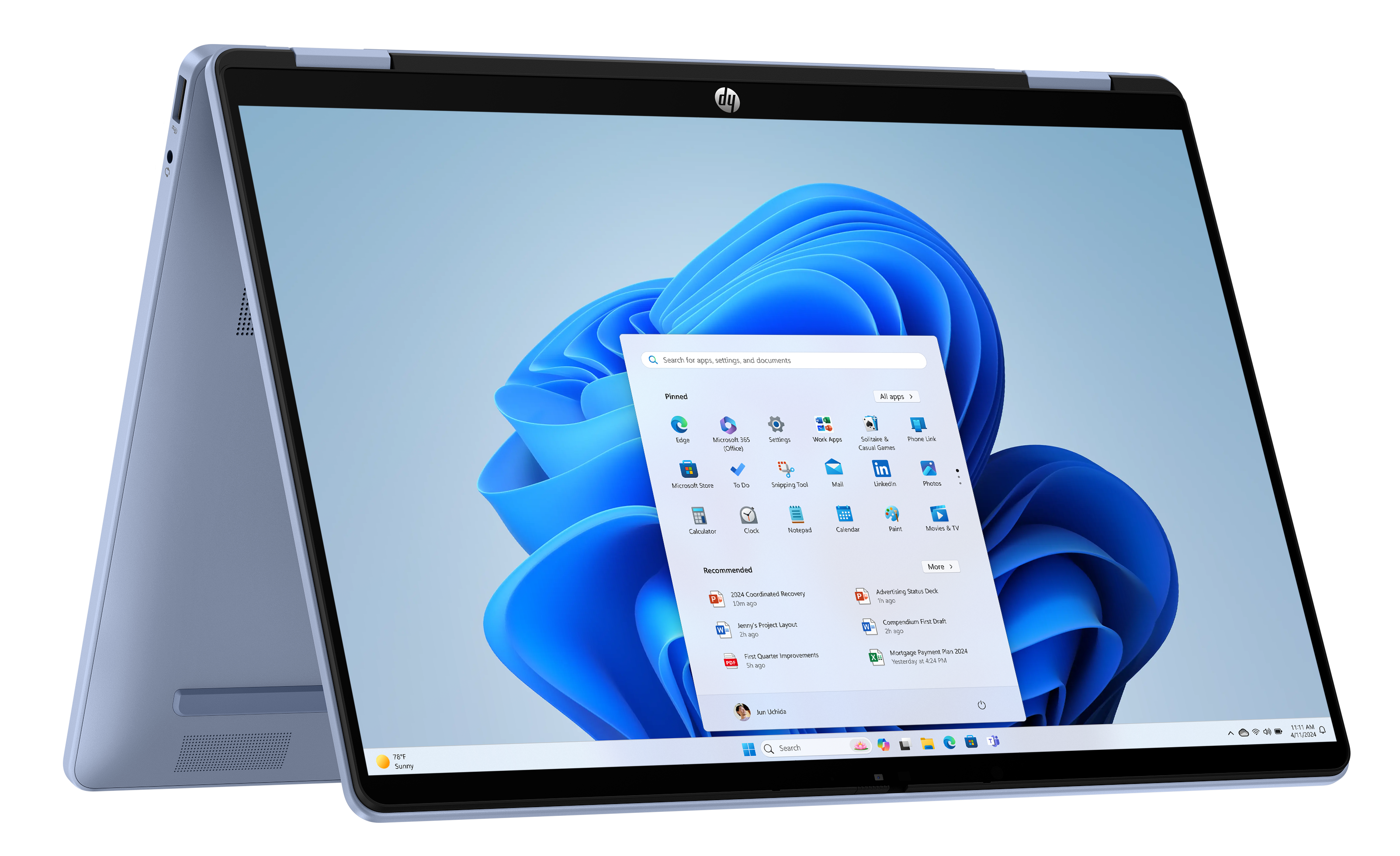 Niebieski laptop konwertowalny HP z otwartym menu Start i niebieskim tłem.
