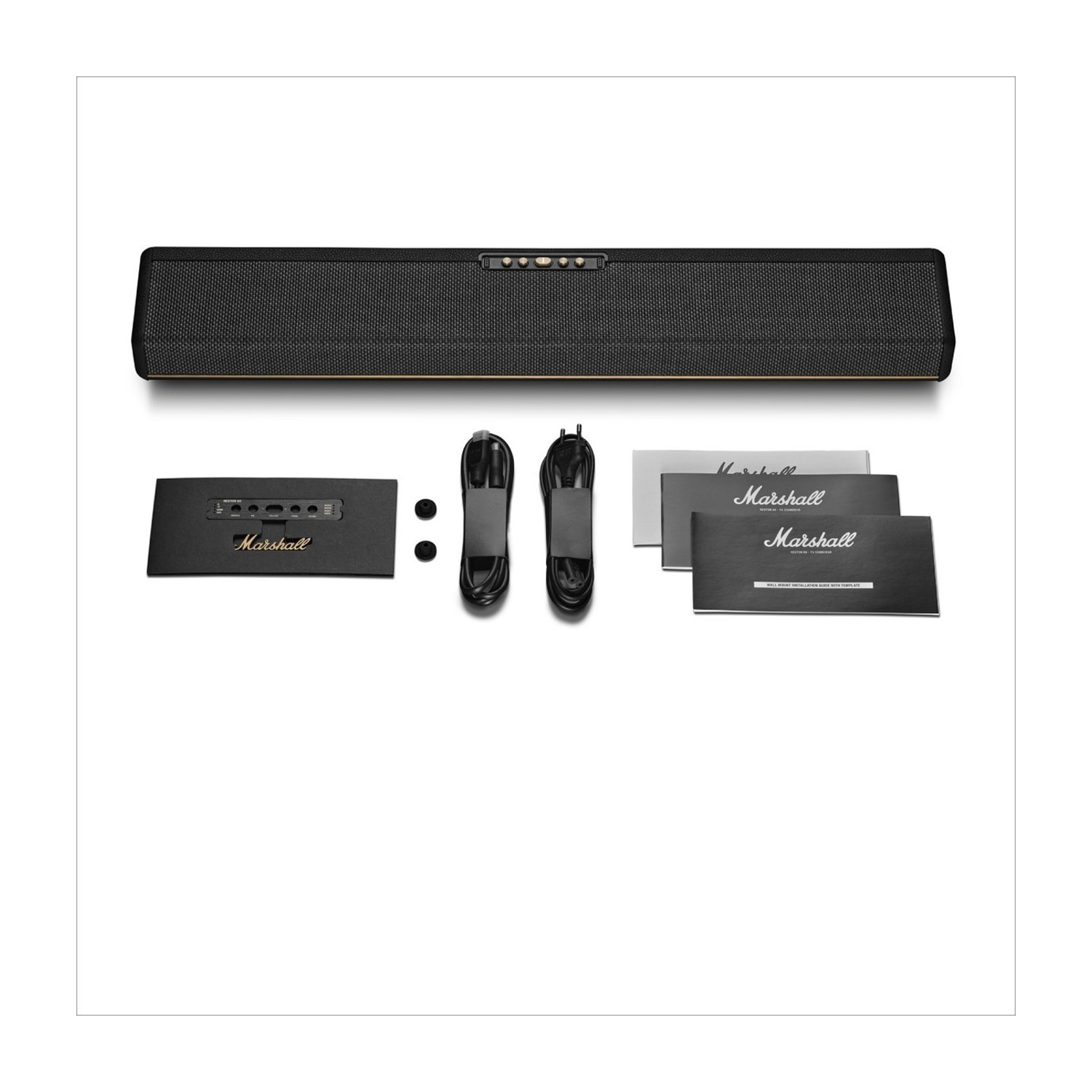 Soundbar Marshall con accessori: cavi, adattatore e manuali.