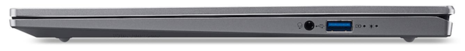 Vista lateral de portátil gris con puerto USB, conector de auriculares y luz indicadora.