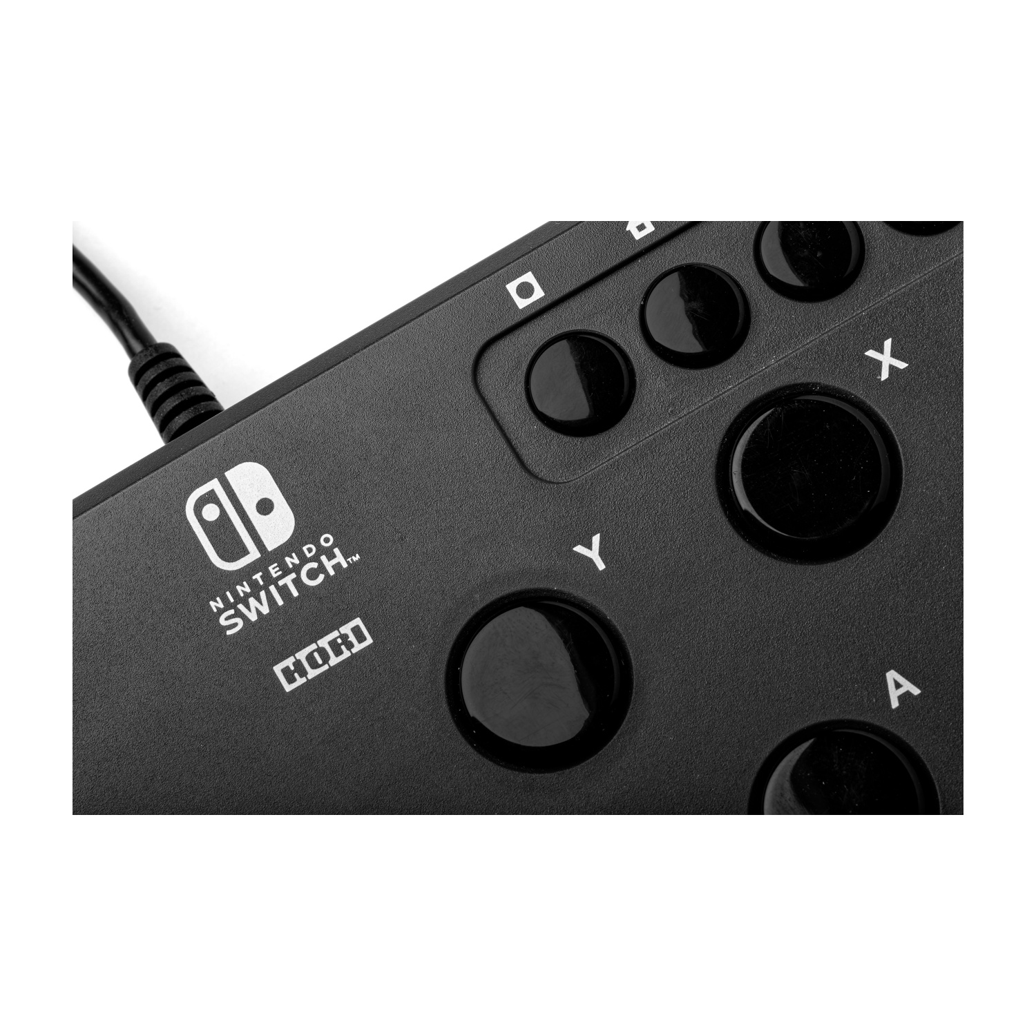 Controller nero Nintendo Switch con pulsanti A, X, Y. Primo piano.