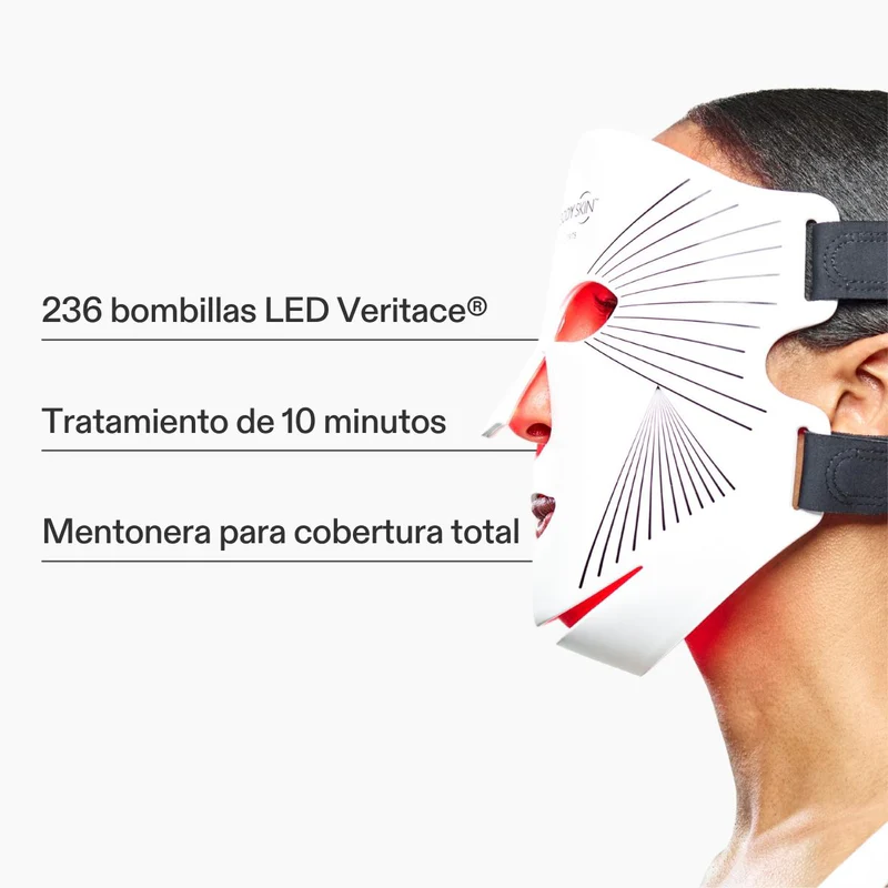 Una mascarilla facial LED blanca con luces rojas usada por una persona.