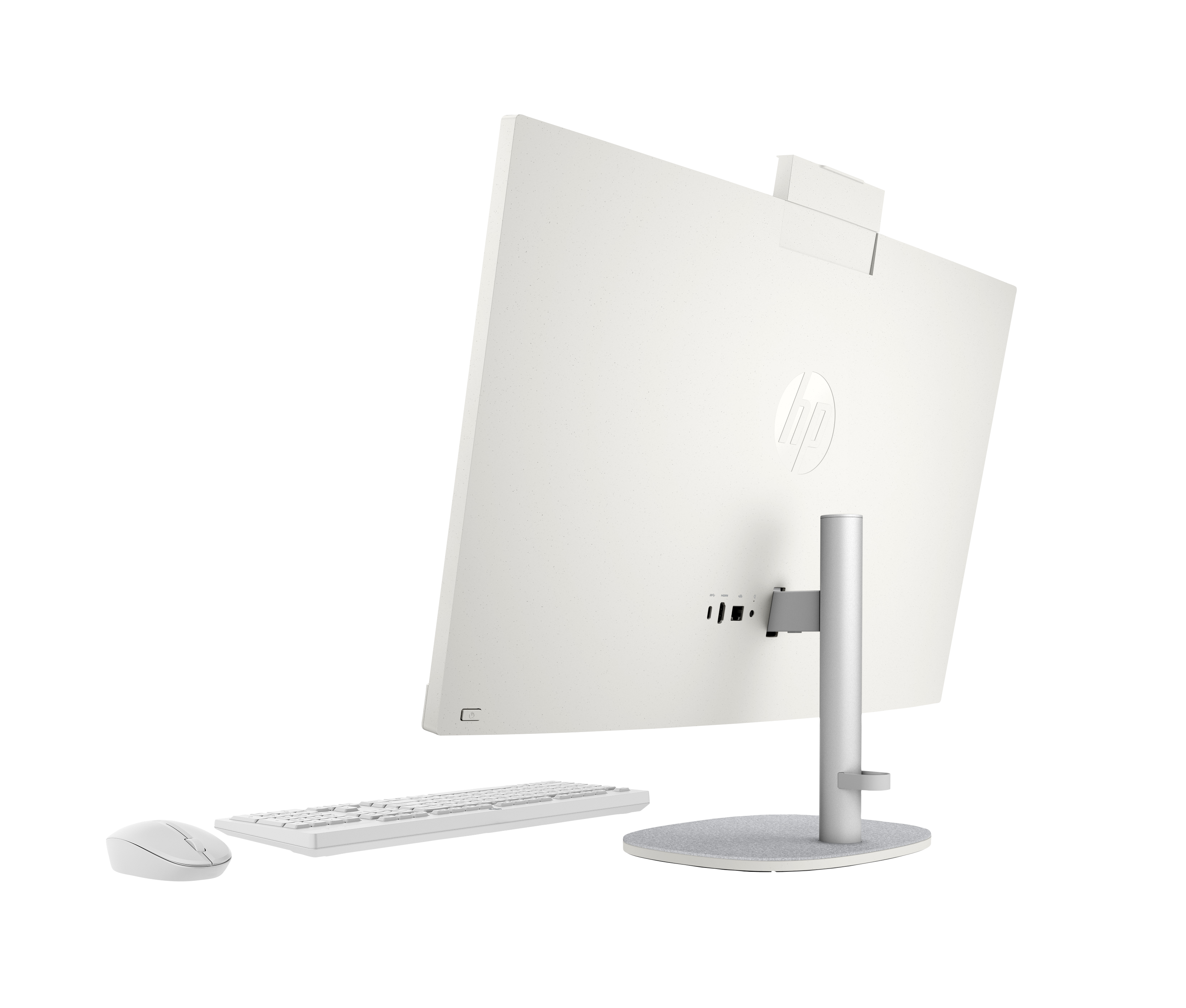Biały komputer typu "wszystko w jednym" z klawiaturą i myszką na czarnym tle.
