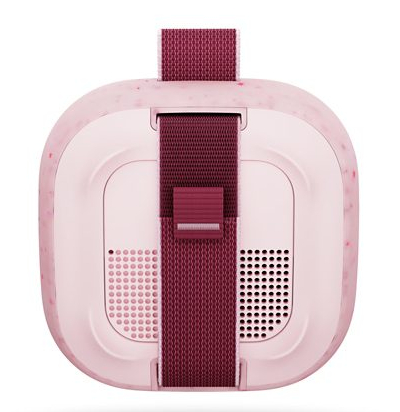 Różowy zestaw VR z ciemnymi paskami i otworami wentylacyjnymi.