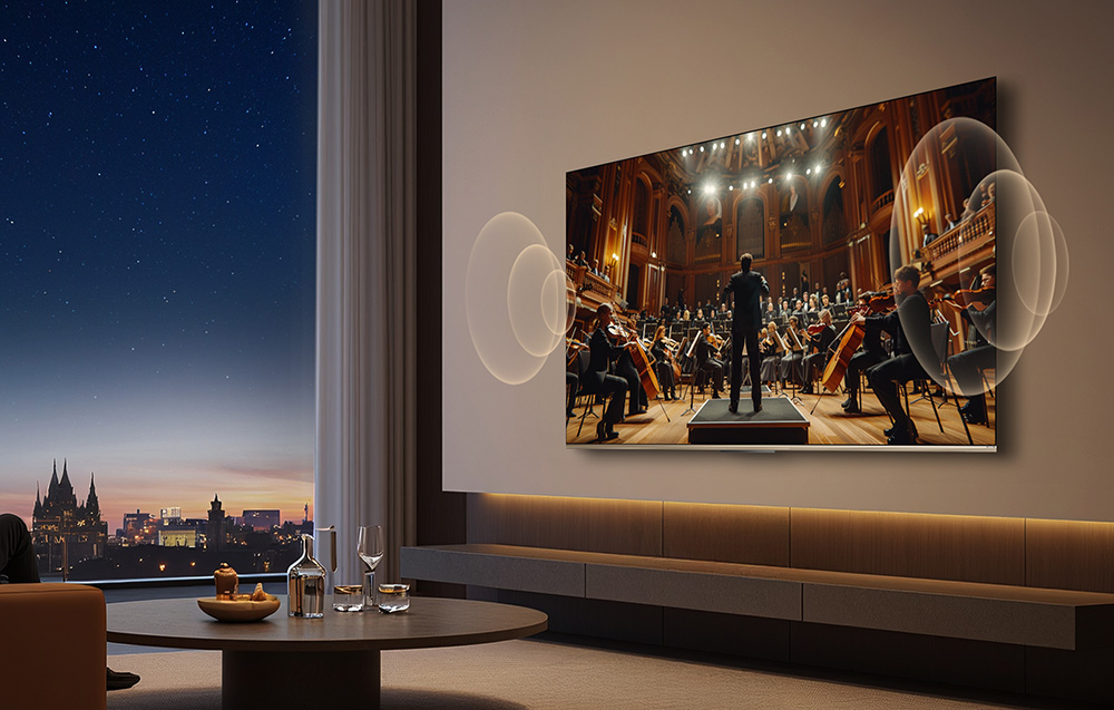 Orkiestra gra na ekranie telewizora na tle nocnego nieba.