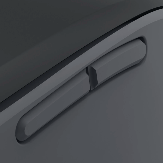 Szare przyciski na ciemnej, gładkiej powierzchni. Widok z bliska.