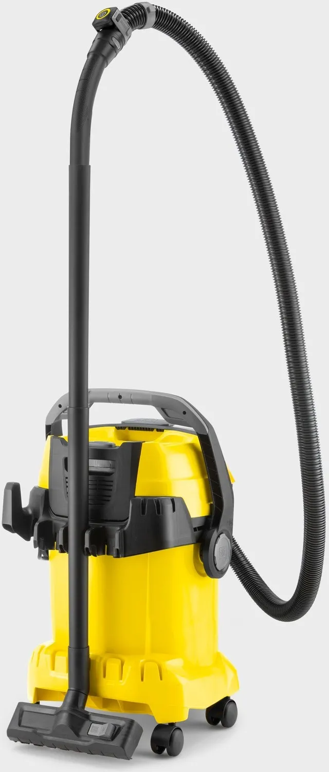 Żółty odkurzacz przemysłowy z czarnym wężem, rurą i dyszą podłogową na kółkach.