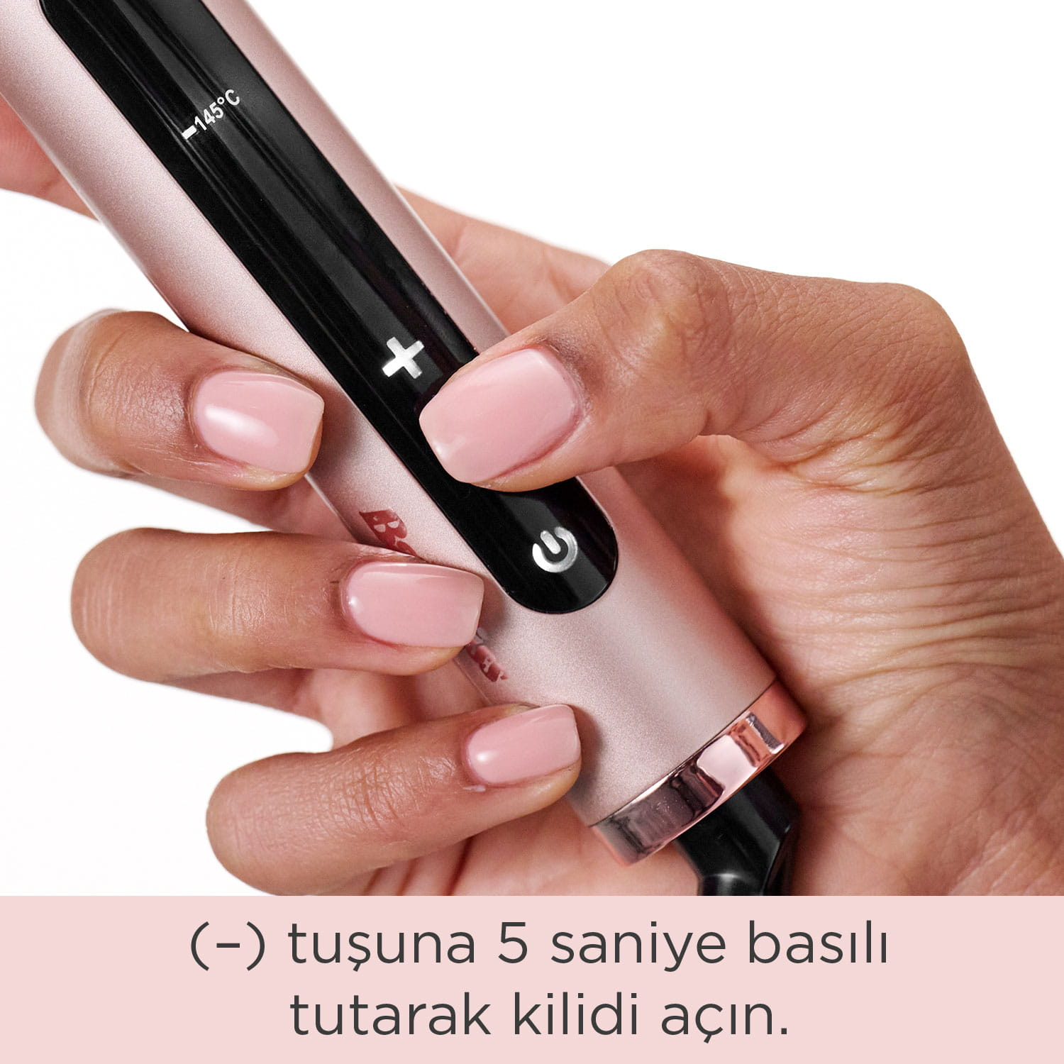 Bir el, 145°C gösteren siyah ekrana sahip, pembe altın rengi bir cihaz tutuyor.