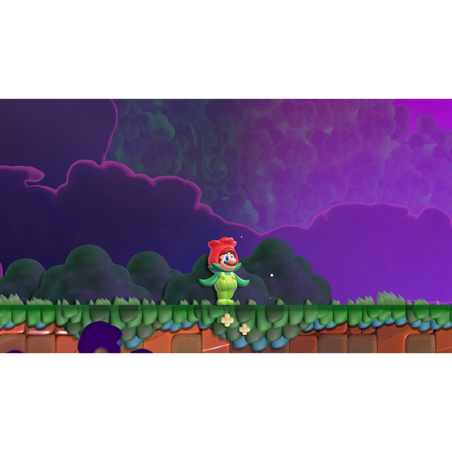 Mario in costume da fiore sta su una piattaforma verde con cielo viola.