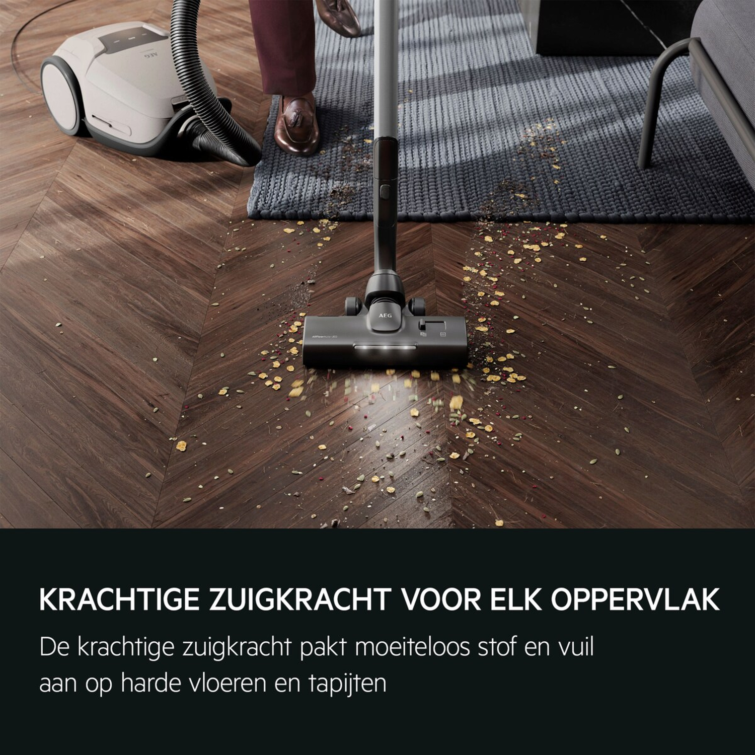 A vacuum cleaner cleans a wooden floor with crumbs.