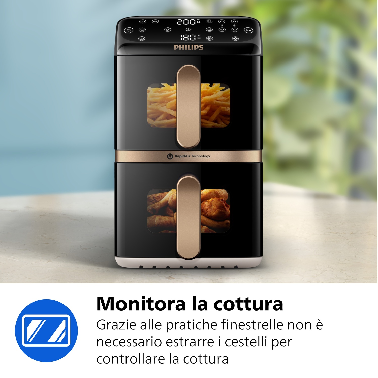 Friteuse ad aria Philips nera con due cestelli, pieni di patatine e pollo.