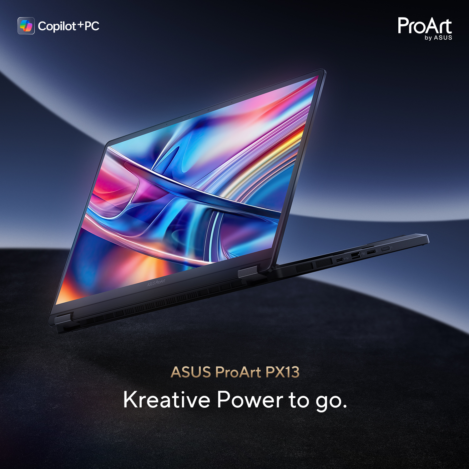Ein offenes ASUS ProArt PX13 Notebook mit buntem Bildschirm, dunklem Hintergrund.