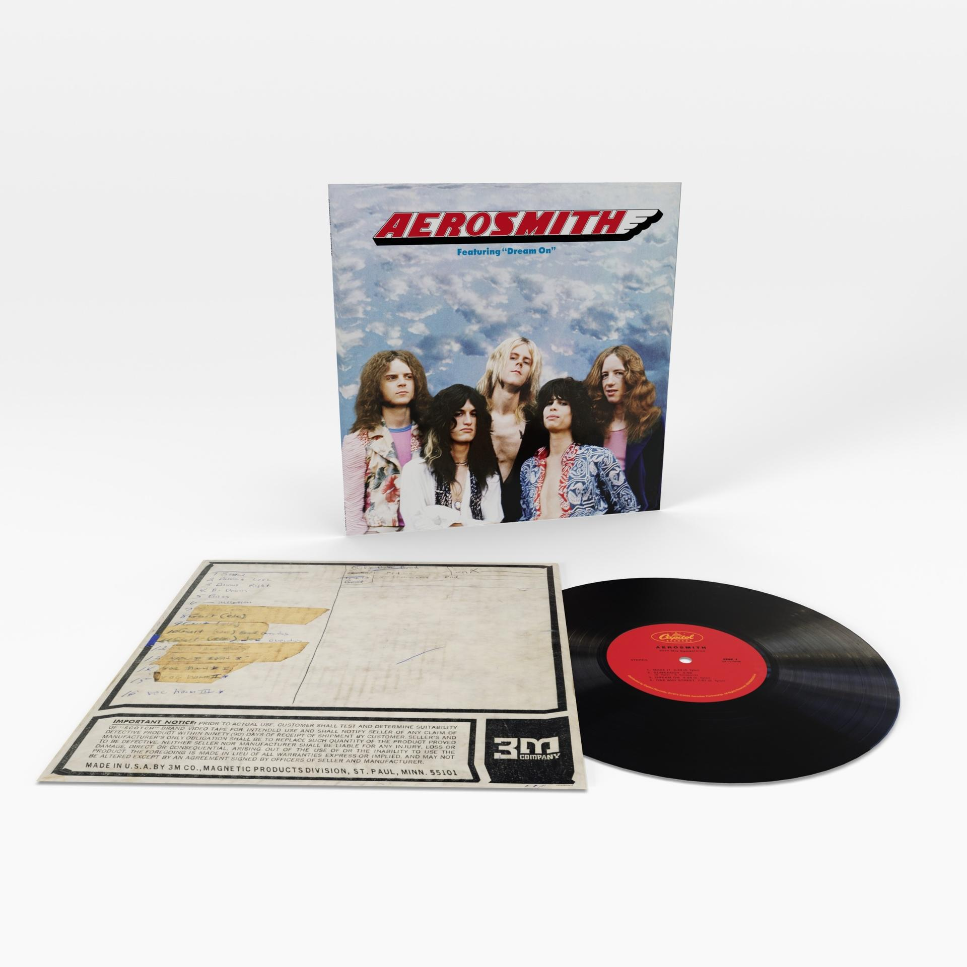 Aerosmith-Albumcover mit Bandmitgliedern, Schallplatte und Notizblatt.