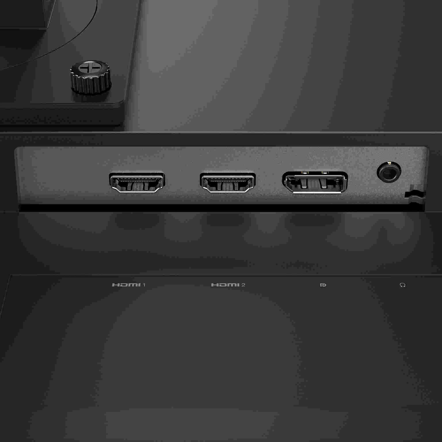 Three HDMI ports and a headphone jack on a black device.