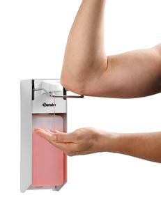 Ein Arm drückt einen Seifenspender, um Seife in eine Hand zu geben.