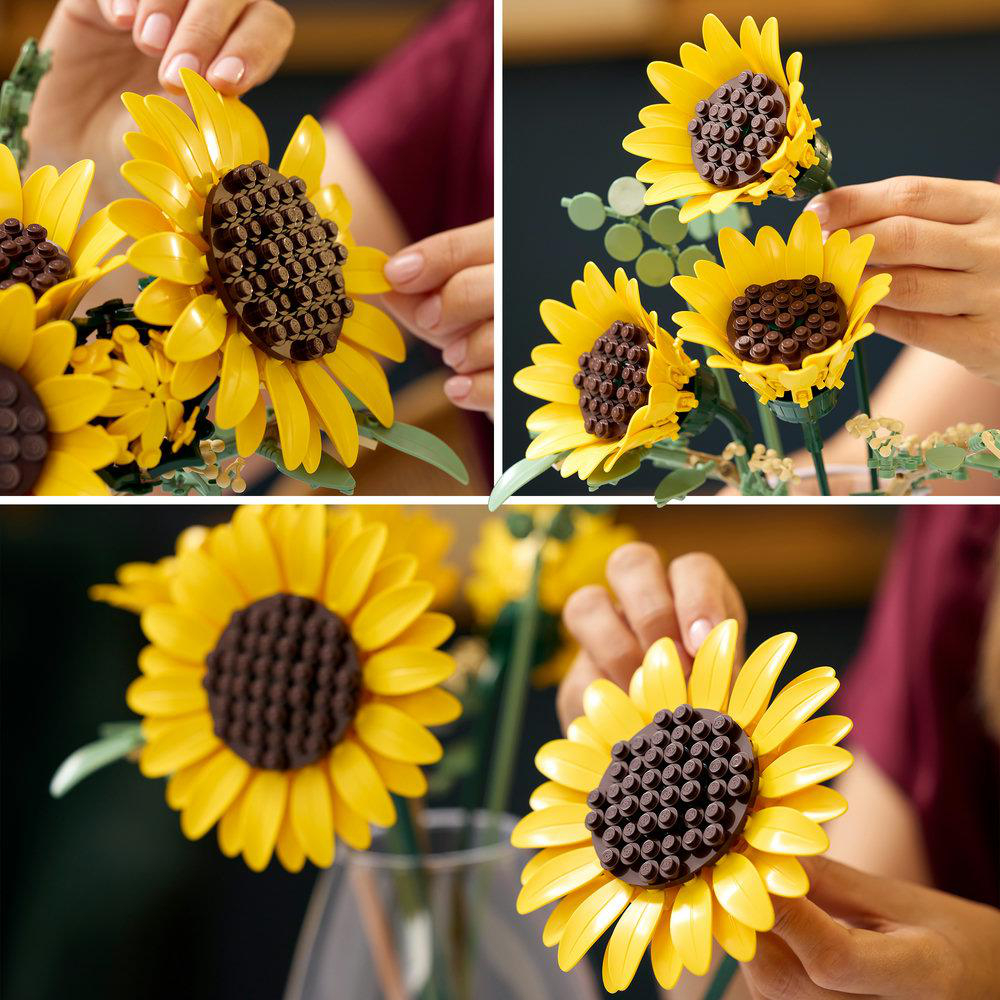 Gelbe Legosternblumen mit braunen Zentren werden von Händen gehalten und arrangiert.