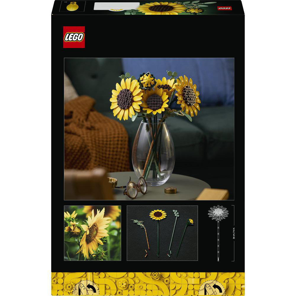 LEGO Sonnenblumen-Set mit Vase, Brille und Stoff auf dem Sofa.