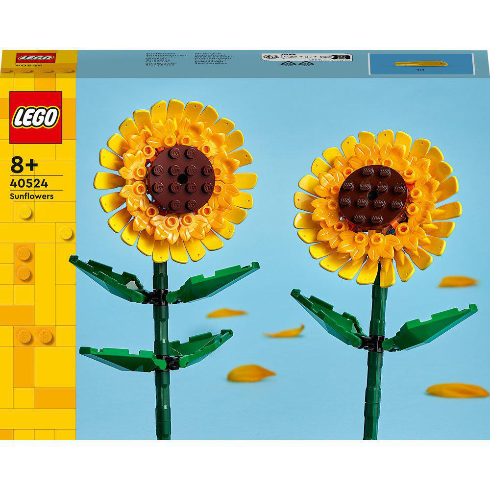 LEGO Sonnenblumen-Set mit zwei Blumen und grünen Blättern auf blauem Hintergrund.