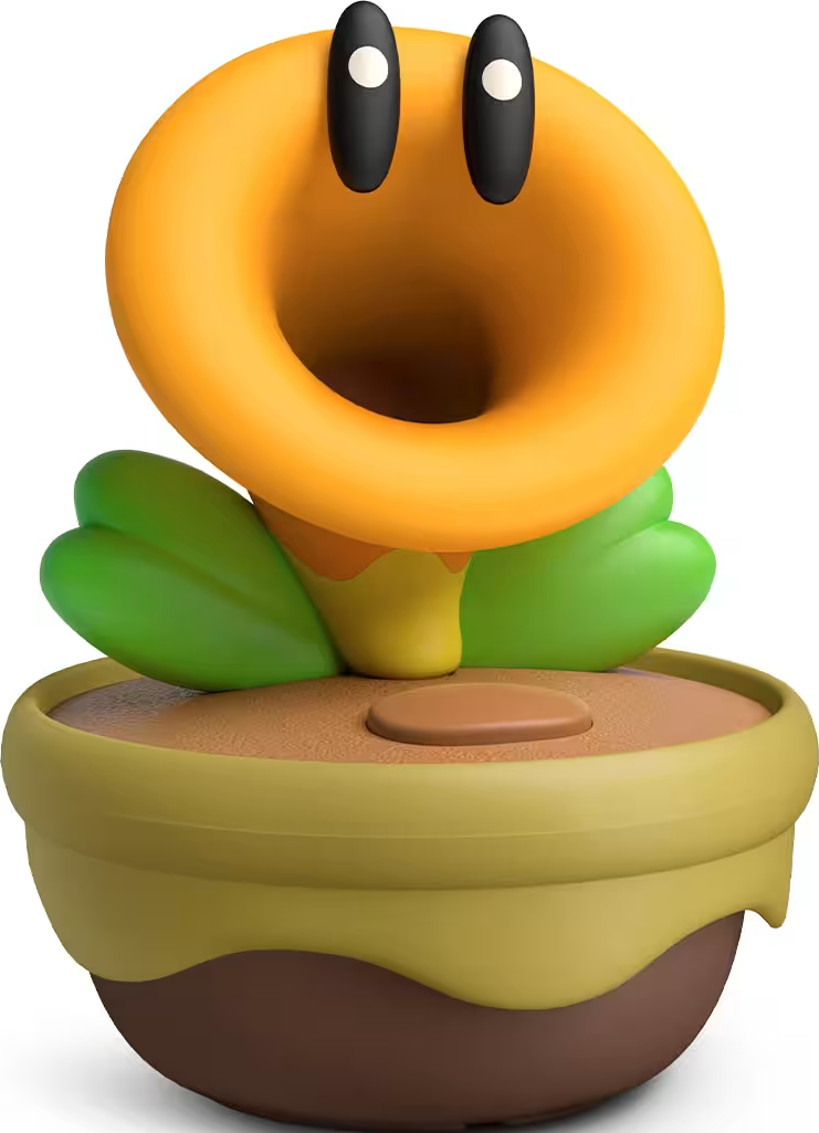 Eine orangefarbene Pflanze mit grünen Blättern und schwarzen Augen in einem Topf.