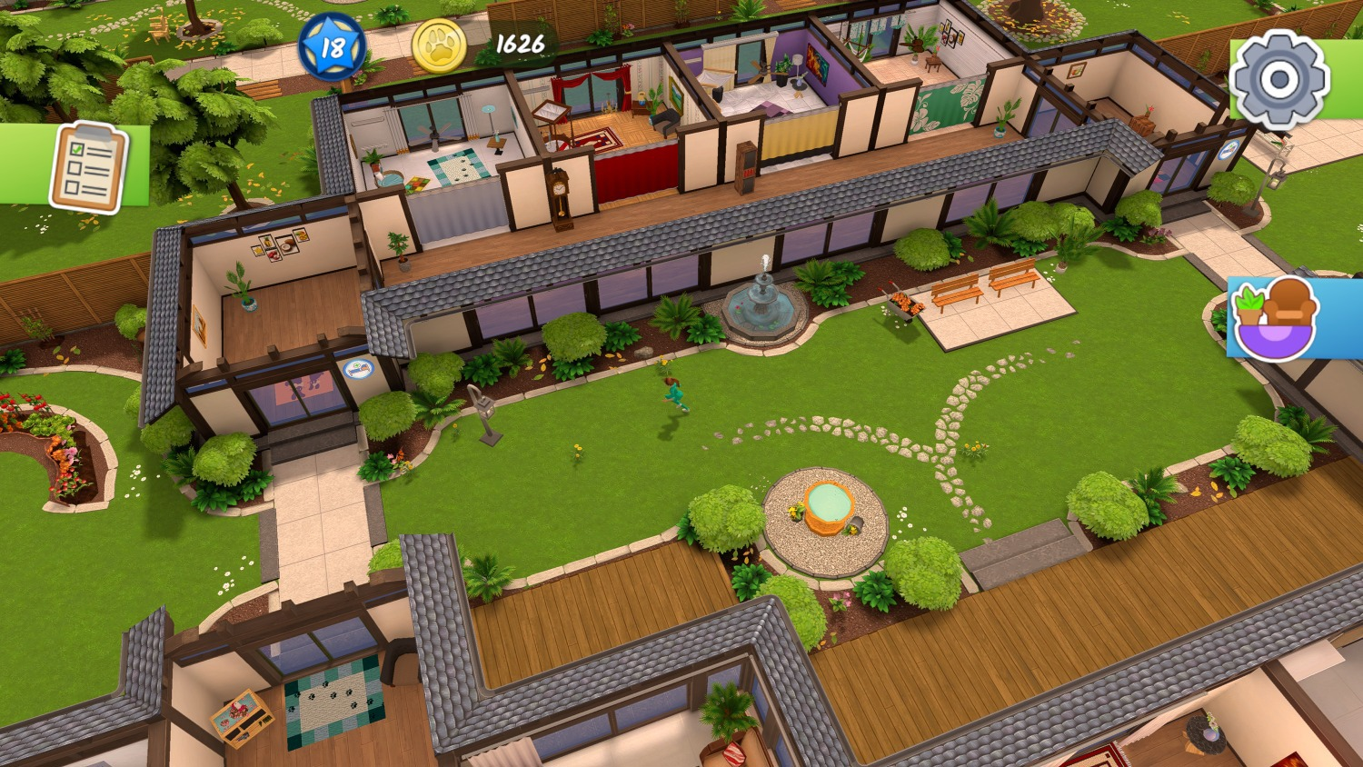 Ein Haus mit Garten, einem Brunnen, Bänken und einem Spielplatz.