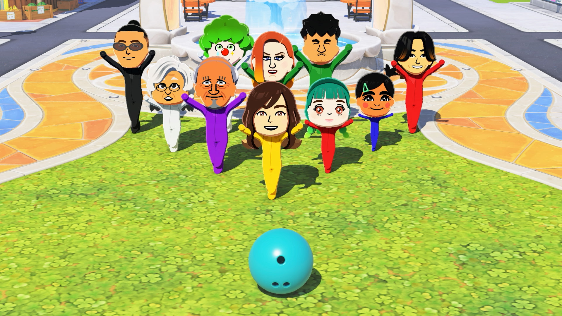 Nove colorati personaggi Mii stanno sull'erba davanti a una palla da bowling blu.