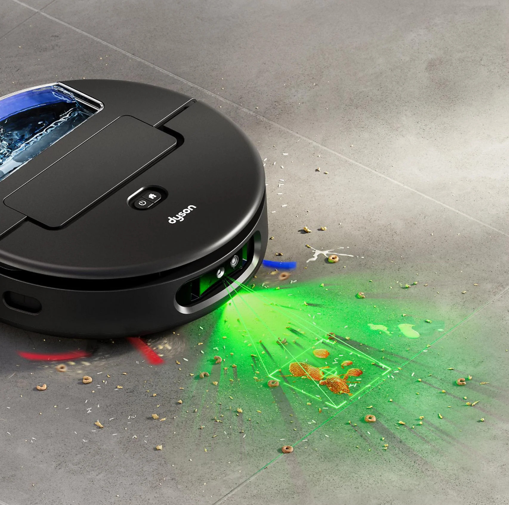 Czarny robot sprzątający czyści podłogę z rozsypanym jedzeniem i płynem.