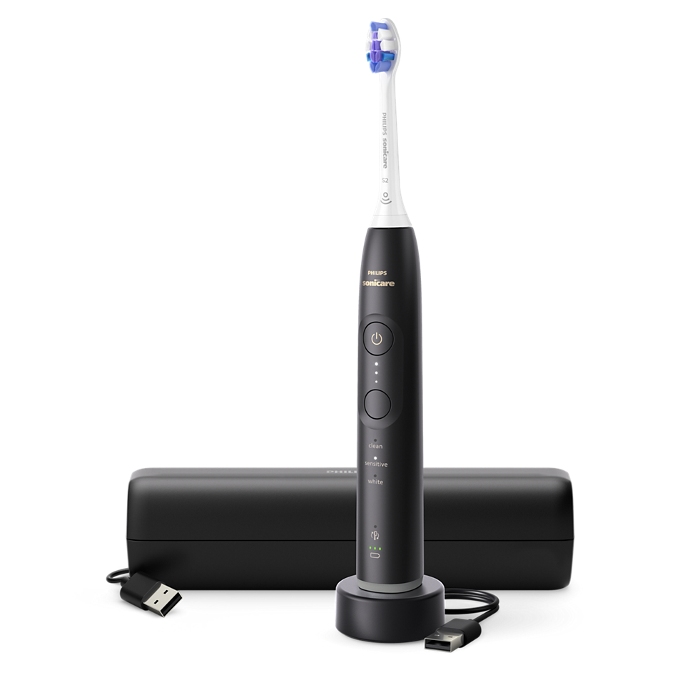 Czarna szczoteczka elektryczna ze stacją ładującą, etui i kablem.